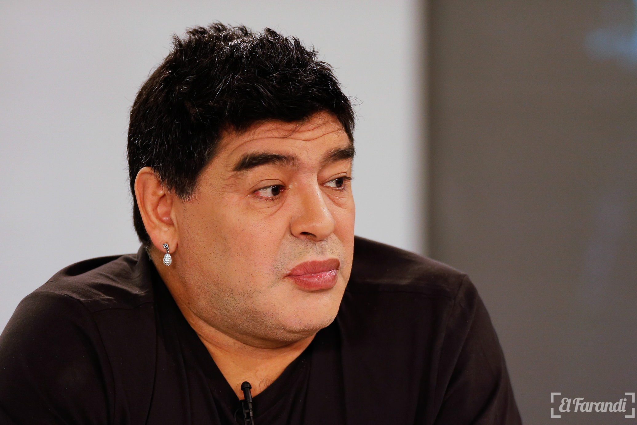 Argentina's soccer legend Diego Maradona looks on as he hosts his television show 'De Zurda' in Caracas