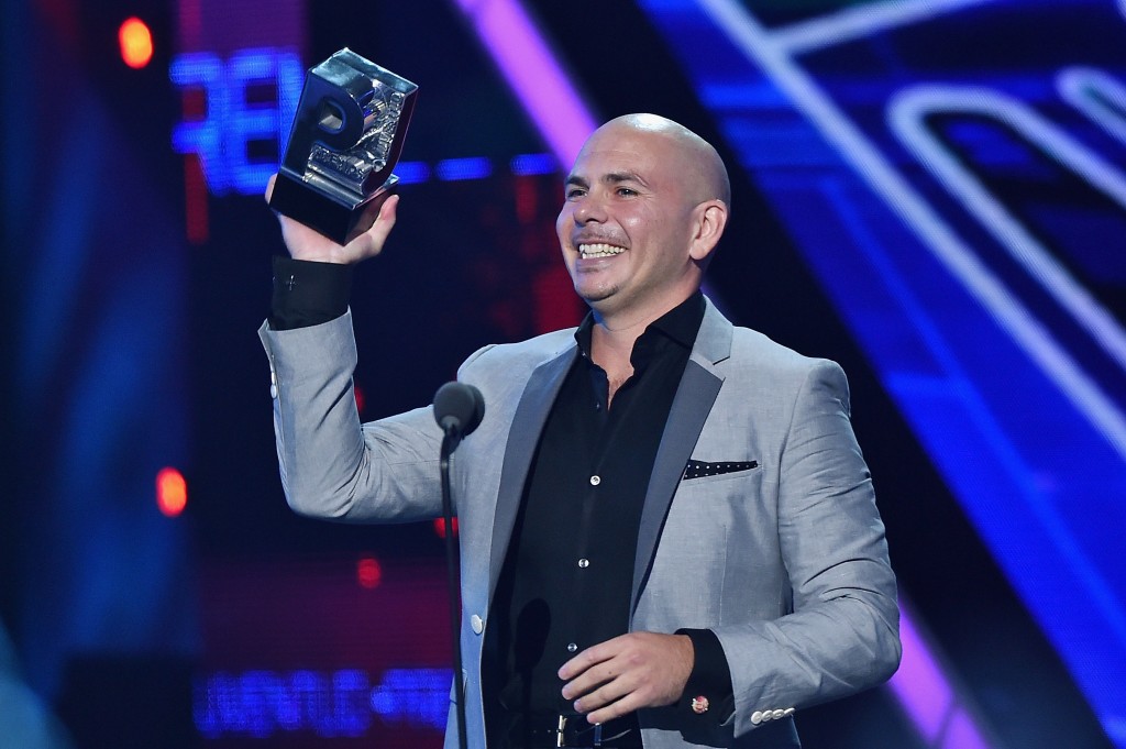 MIAMI, FL - JULY 16: Pitbull accepts award onstage at Univision's Premios Juventud 2015 at Bank United Center on July 16, 2015 in Miami, Florida.   Rodrigo Varela/Getty Images For Univision/AFP