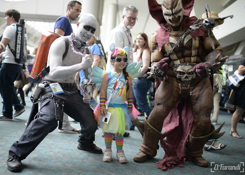 Daisy Fu Odelberg (C), dressed as the character Rainbow Dash from "My Little Pony," poses with other cosplayers outside the San Diego Convention Center at Comic Con International 2015 in San Diego on July 10, 2015. AFP PHOTO/ROBYN BECK