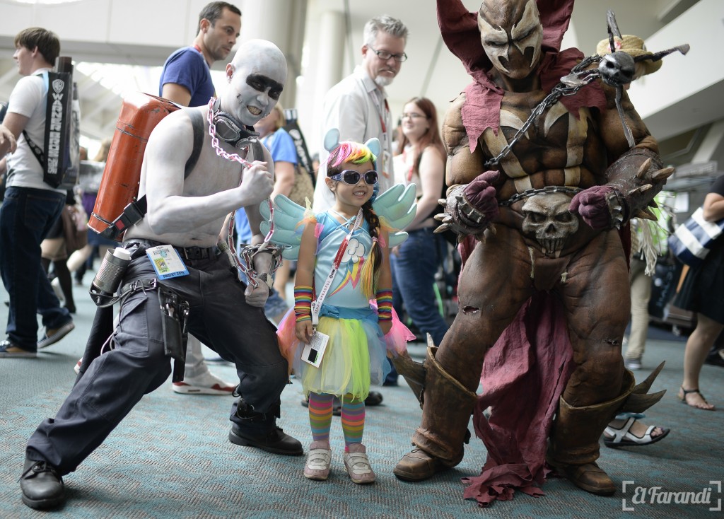 Daisy Fu Odelberg (C), dressed as the character Rainbow Dash from "My Little Pony," poses with other cosplayers outside the San Diego Convention Center at Comic Con International 2015 in San Diego on July 10, 2015.  AFP PHOTO/ROBYN BECK