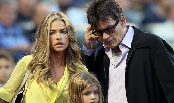 NEW YORK, NY - JUNE 23: Denise Richards and Charlie Sheen look for their seats as the New York Yankees take on the New York Mets on June 23, 2012 during interleague play at Citi Field in the Flushing neighborhood of the Queens borough of New York City.   Elsa/Getty Images/AFP