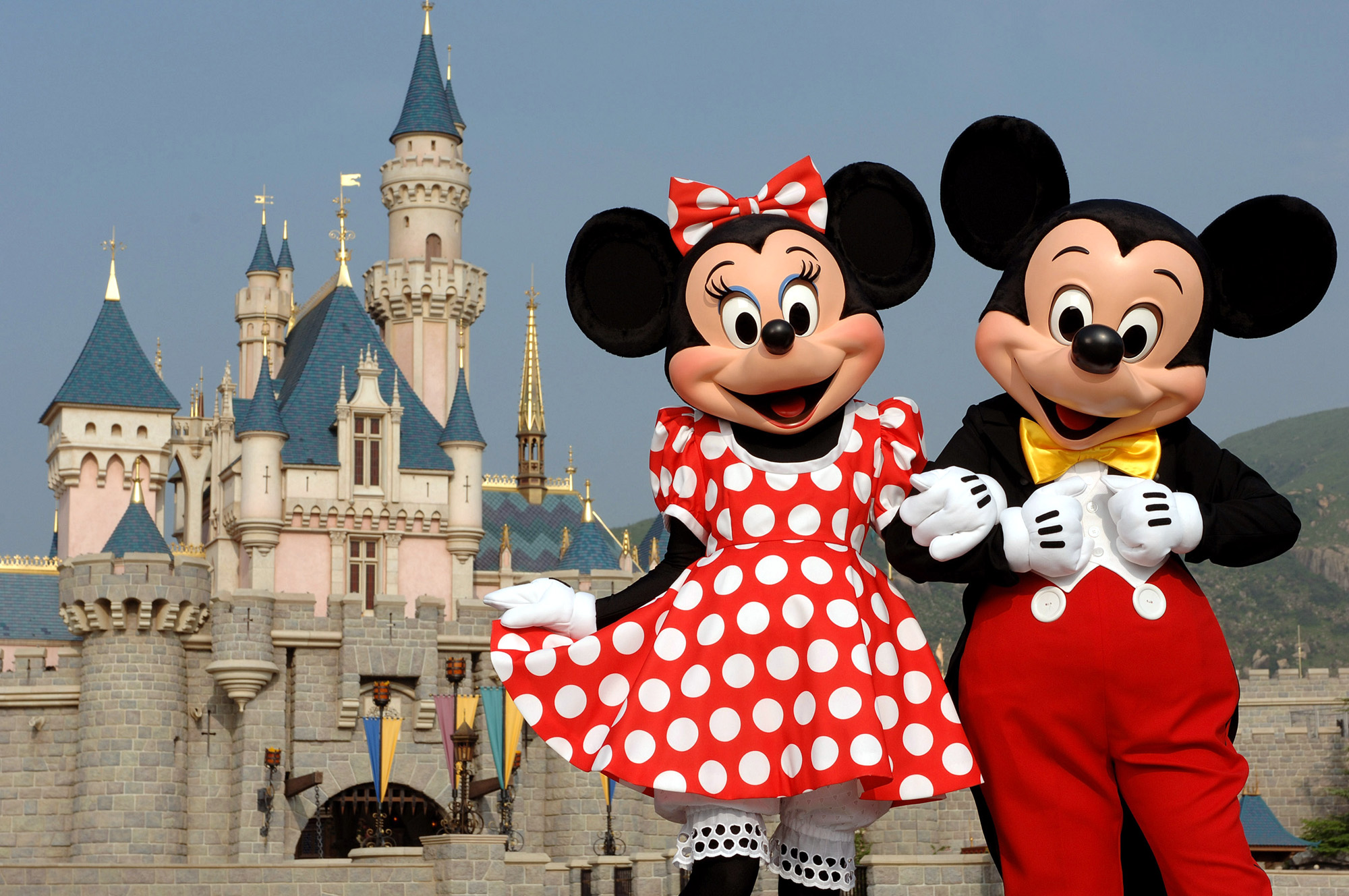 **FOR IMMEDIATE RELEAE** In this photo released by Hong Kong Disneyland, Disney characters Mickey Mouse and Minnie Mouse pose in front of the Sleeping Beauty Castle in Hong Kong's Disneyland Park, Sept. 1, 2005. (AP Photo/Disneyland, Mark Ashman)