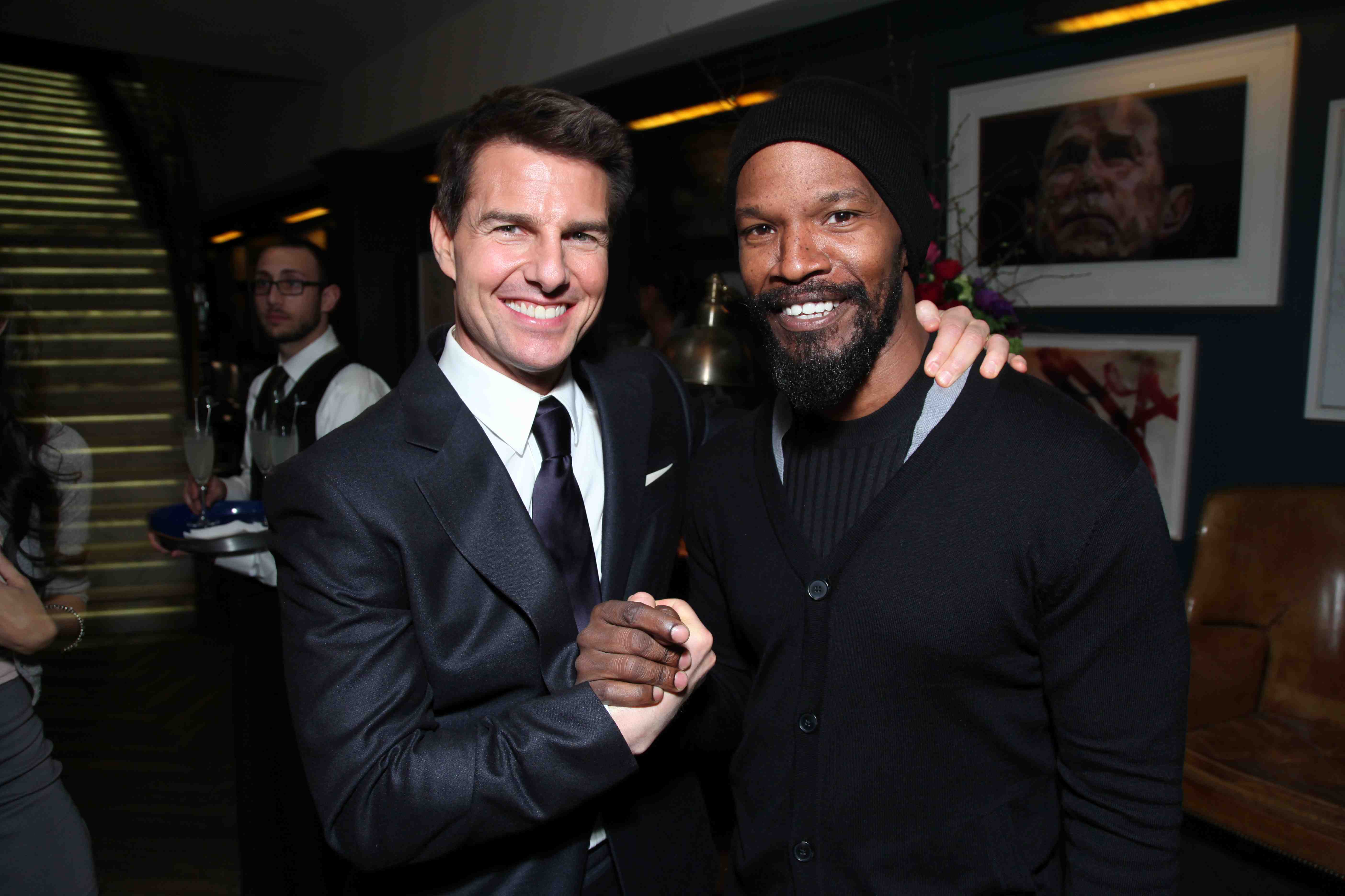 Tom Cruise and Jamie Foxx pose as CAA hosts a Golden Globe pre-party in Hollywood, CA on Friday, January 13, 2012. (Alex J. Berliner/abimages)