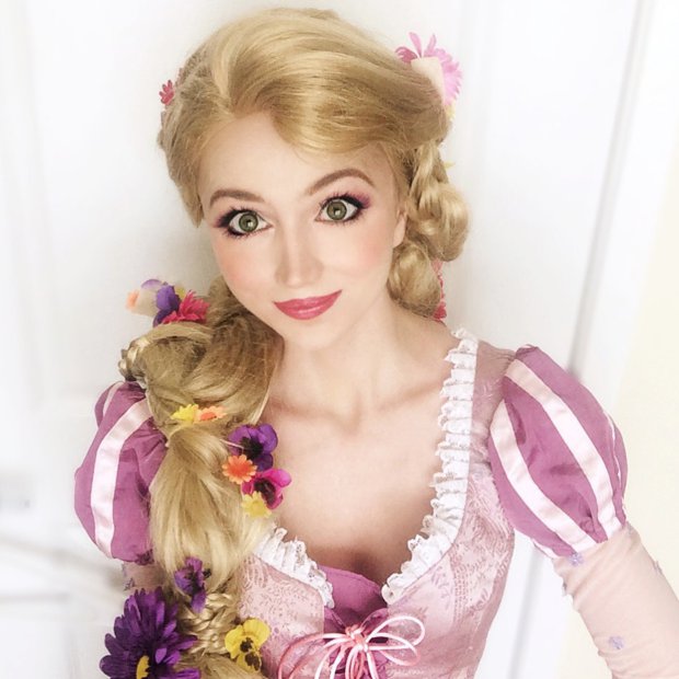 Pic by HotSpot Media - WOMAN SPENDS £10K TRANSFORMING INTO DISNEY PRINCESSES - IN PIC - Sarah Ingle, 25, dressed as Rapunzel. - Meet the real life princess who has spent £10k transforming herself into nine Disney beauties. With her petite figure and huge doe eyes, 25 year-old American beauty Sarah Ingle bears a striking resemblance to animated characters including Queen Elsa from Frozen, Ariel from The Little Mermaid and Snow White. The full time marketing manager from Denver, Colorado, spends her weekends transforming herself into fairytale princesses - entertaining children with her alter ego And being a real life princess comes with an eye-watering price tag. To date, the pretty brunette has spent £10,000 on her magical collection of 17 custom made princess outfits. Sarah, who spends up to £1500 on each outfit, says: ⿿I have always loved singing and I have always loved Disney, so it was no surprise to my family and friends when I began performing as a princess...SEE HOTSPOT MEDIA COPY 0121 551 1004