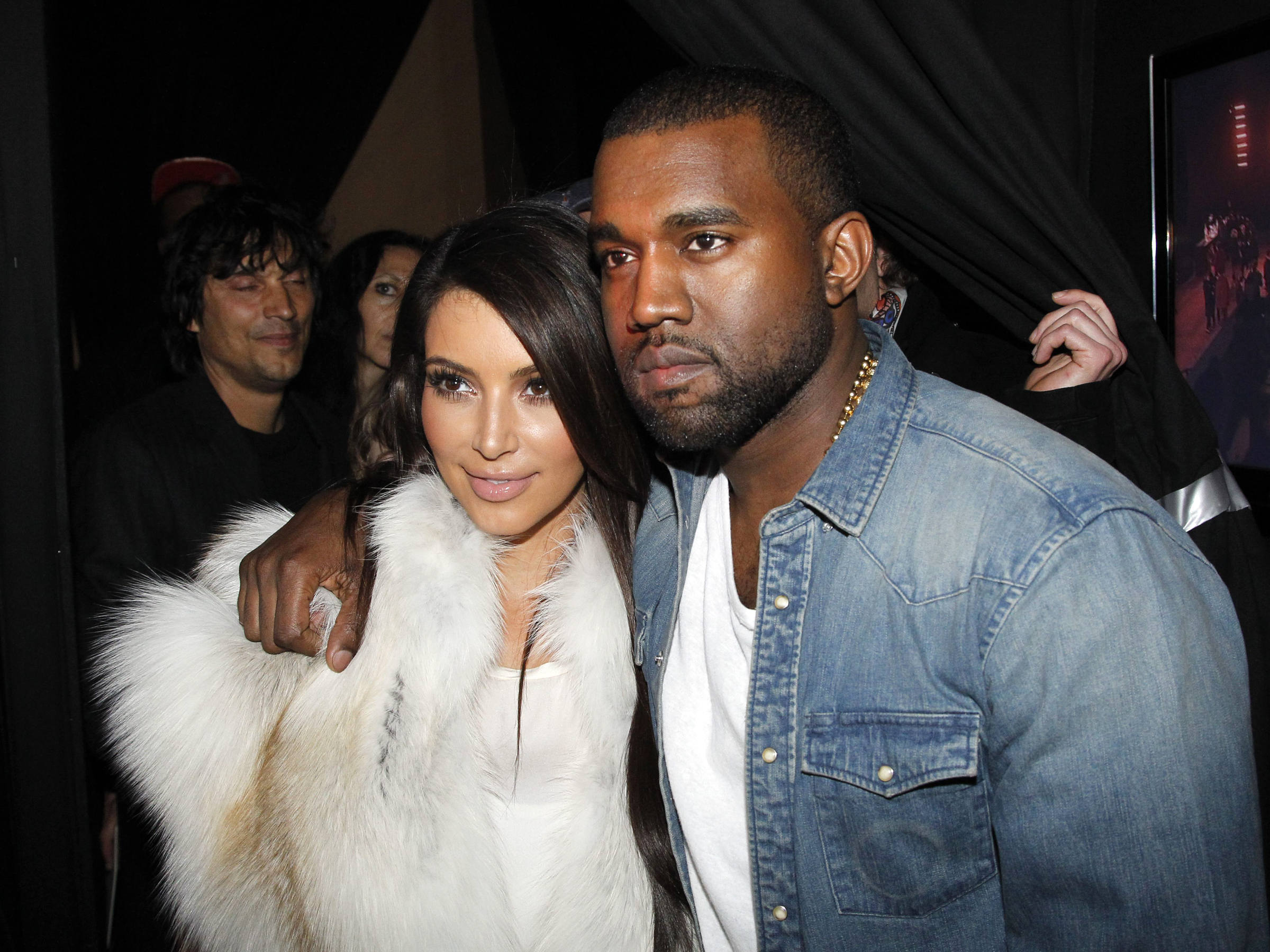 PARIS, FRANCE - MARCH 06: Kim Kardashian and Kanye West attend the Kanye West  Ready-To-Wear Fall/Winter 2012 show as part of Paris Fashion Week at Halle Freyssinet on March 6, 2012 in Paris, France. (Photo by Eric Ryan/Getty Images)