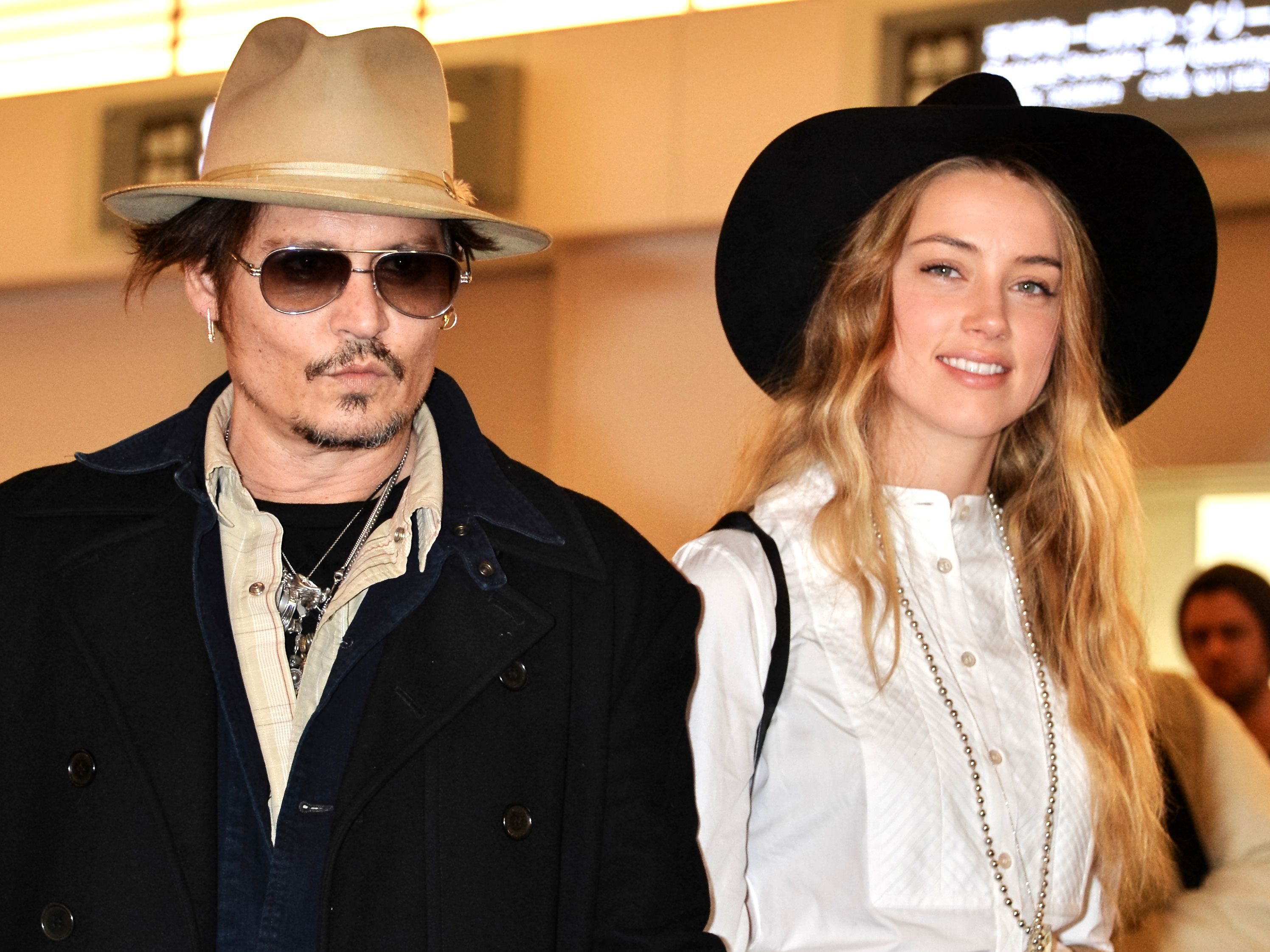 Mandatory Credit: Photo by Aflo/REX (4383395g) Johnny Depp and Amber Heard Johnny Depp and Amber Heard at Haneda International airport, Tokyo, Japan - 26 Jan 2015