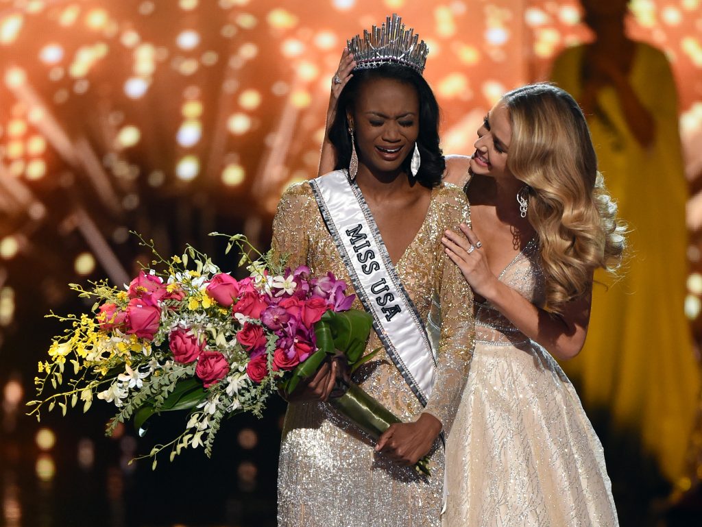 LAS VEGAS, NV - JUNE 05: Miss District of Columbia USA 2016 Deshauna Barber (L) reacts as she is crowned Miss USA 2016 by Miss USA 2015 Olivia Jordan during the 2016 Miss USA pageant at T-Mobile Arena on June 5, 2016 in Las Vegas, Nevada.   Ethan Miller/Getty Images/AFP