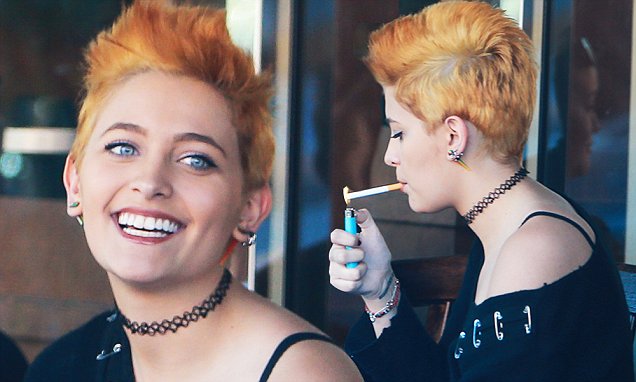 EXCLUSIVE. Coleman-Rayner. Los Angeles CA, USA. nFebruary 25, 2016nParis Jackson is seen sporting her funky, new strawberry blonde pixie cut while grabbing coffee and chatting with a friend in Sherman Oaks. The pair were seen smoking despite being under the legal age and seemed to be having a serious conversation. The 17-year-old daughter of Michael Jackson comforted her friend who seemed visible upset.nCREDIT LINE MUST READ: Coqueran/Coleman-RaynernTel US (001) 310-474-4343 - office nTel US (001) 323 545 7584 - cellnwww.coleman-rayner.com