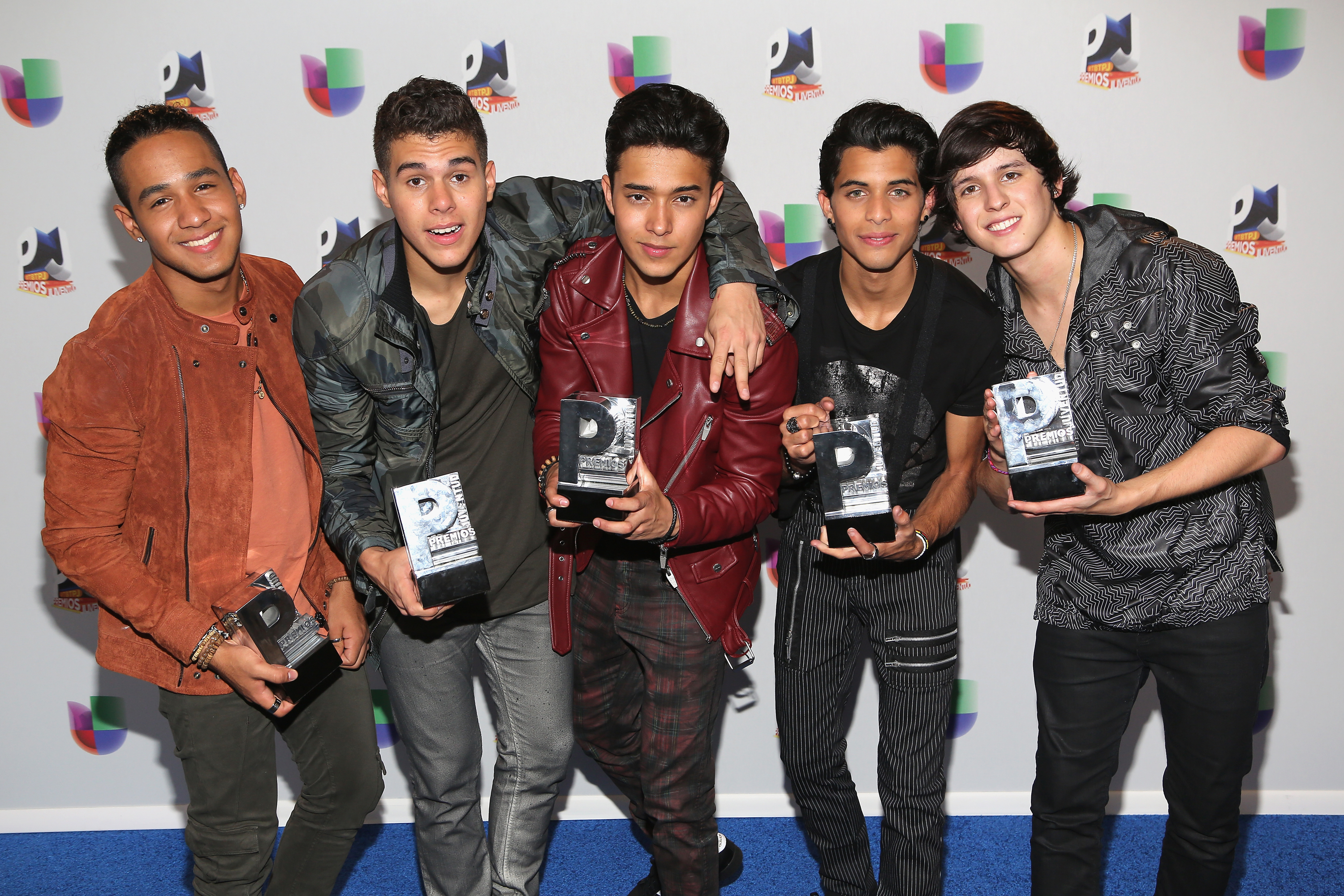 MIAMI, FL - JULY 14: Singers Zabdiel de Jesus, Richard Camacho, Erick Brian Colon, Joel Pimentel and Christopher Velez of CNCO pose with awards at the Univision's 13th Edition Of Premios Juventud Youth Awards at Bank United Center on July 14, 2016 in Miami, Florida.   Alexander Tamargo/Getty Images/AFP