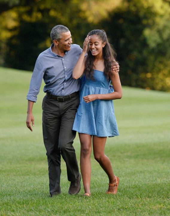 US President Barack Obama (L) and  daughter Malia arrive at the White House in Washington, D.C on August 23, 2015 upon their return from vacationing at Martha's Vineyard. Photo by Olivier Douliery/SIPA
