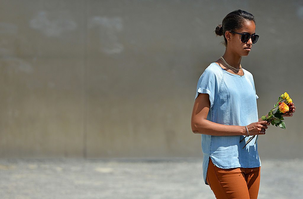 BERLIN, GERMANY - JUNE 19: Malia Obama visits the Berlin Wall memorial at Bernauer Strasse on June 19, 2013 in Berlin, Germany. U.S. President Barack Obama is visiting Berlin for the first time during his presidency and his speech at the Brandenburg Gate is to be the highlight. Obama will be speaking close to the 50th anniversary of the historic speech by then U.S. President John F. Kennedy in Berlin in 1963, during which he proclaimed the famous sentence: Ich bin ein Berliner. (Photo by Miriam May - Pool /Getty Images)