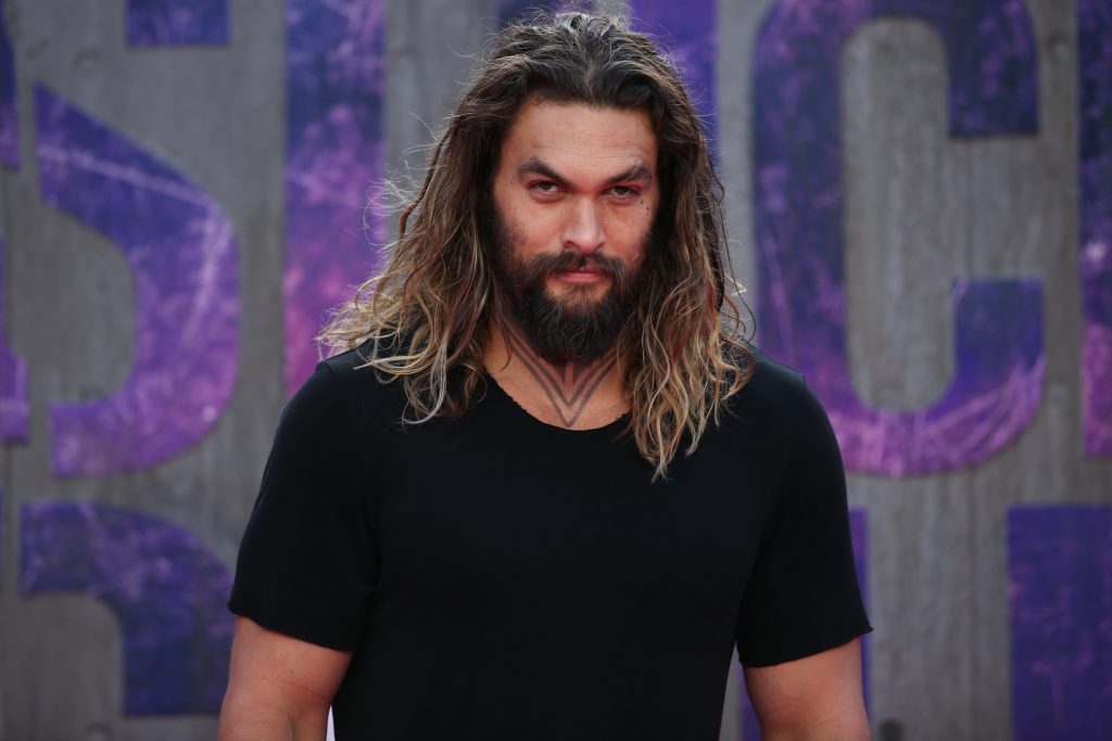 Actor Jason Momoa poses as he arrives to attend the European premiere of the film Suicide Squad in central London on August 3, 2016.  / AFP PHOTO / JUSTIN TALLIS