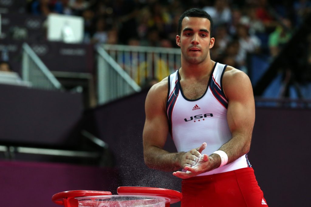 LONDON, ENGLAND - JULY 30: Danell Leyva of the United States of America chalks his hands in the Artistic Gymnastics Men's Team final on Day 3 of the London 2012 Olympic Games at North Greenwich Arena on July 30, 2012 in London, England. (Photo by Ronald Martinez/Getty Images)