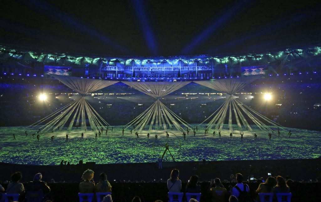 2016 Rio Olympics - Opening ceremony - Maracana - Rio de Janeiro, Brazil - 05/08/2016. Fans watch the opening ceremony. REUTERS/Andrew Boyers FOR EDITORIAL USE ONLY. NOT FOR SALE FOR MARKETING OR ADVERTISING CAMPAIGNS.