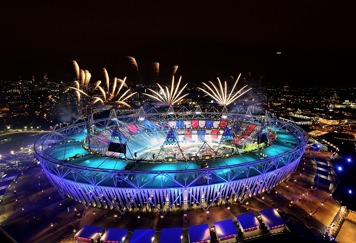 LONDON, ENGLAND - JULY 27:  Fireworks ignite over the Olympic Stadium during the Opening Ceremony for the London 2012 Olympic Games on July 27, 2012 at Olympic Park in London, England.  (Photo by Jamie Squire/Getty Images)