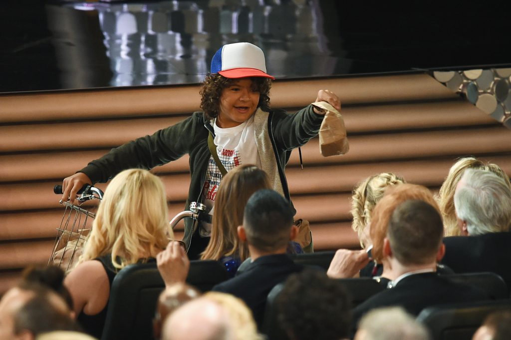 LOS ANGELES, CA - SEPTEMBER 18: Actor Gaten Matarazzo passes out peanut butter and jelly sandwiches to the audience during the 68th Annual Primetime Emmy Awards at Microsoft Theater on September 18, 2016 in Los Angeles, California. Kevin Winter/Getty Images/AFP