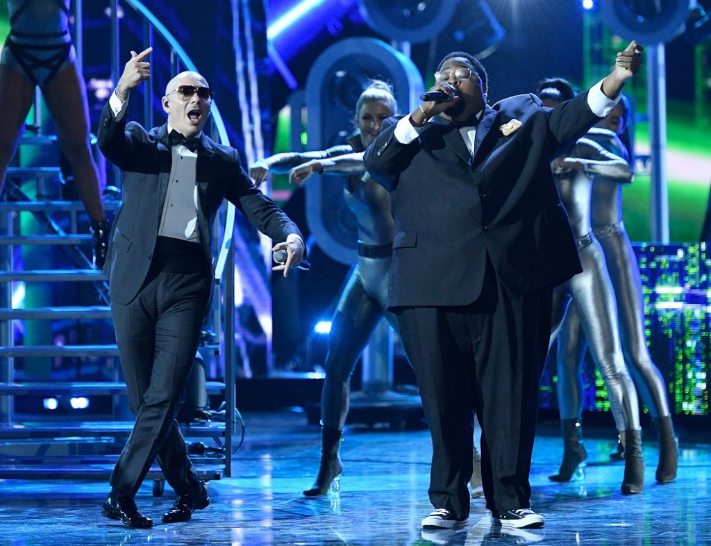 HOLLYWOOD, CA - OCTOBER 06: Recording artists Pitbull (L) and LunchMoney Lewis perform onstage during the 2016 Latin American Music Awards at Dolby Theatre on October 6, 2016 in Hollywood, California. Mike Windle/Getty Images/AFP