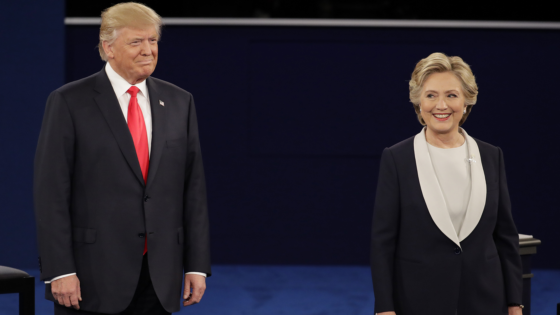 Republican presidential nominee Donald Trump stands next to Democratic presidential nominee Hillary Clinton during the second presidential debate at Washington University in St. Louis, Sunday, Oct. 9, 2016. (AP Photo/Julio Cortez)