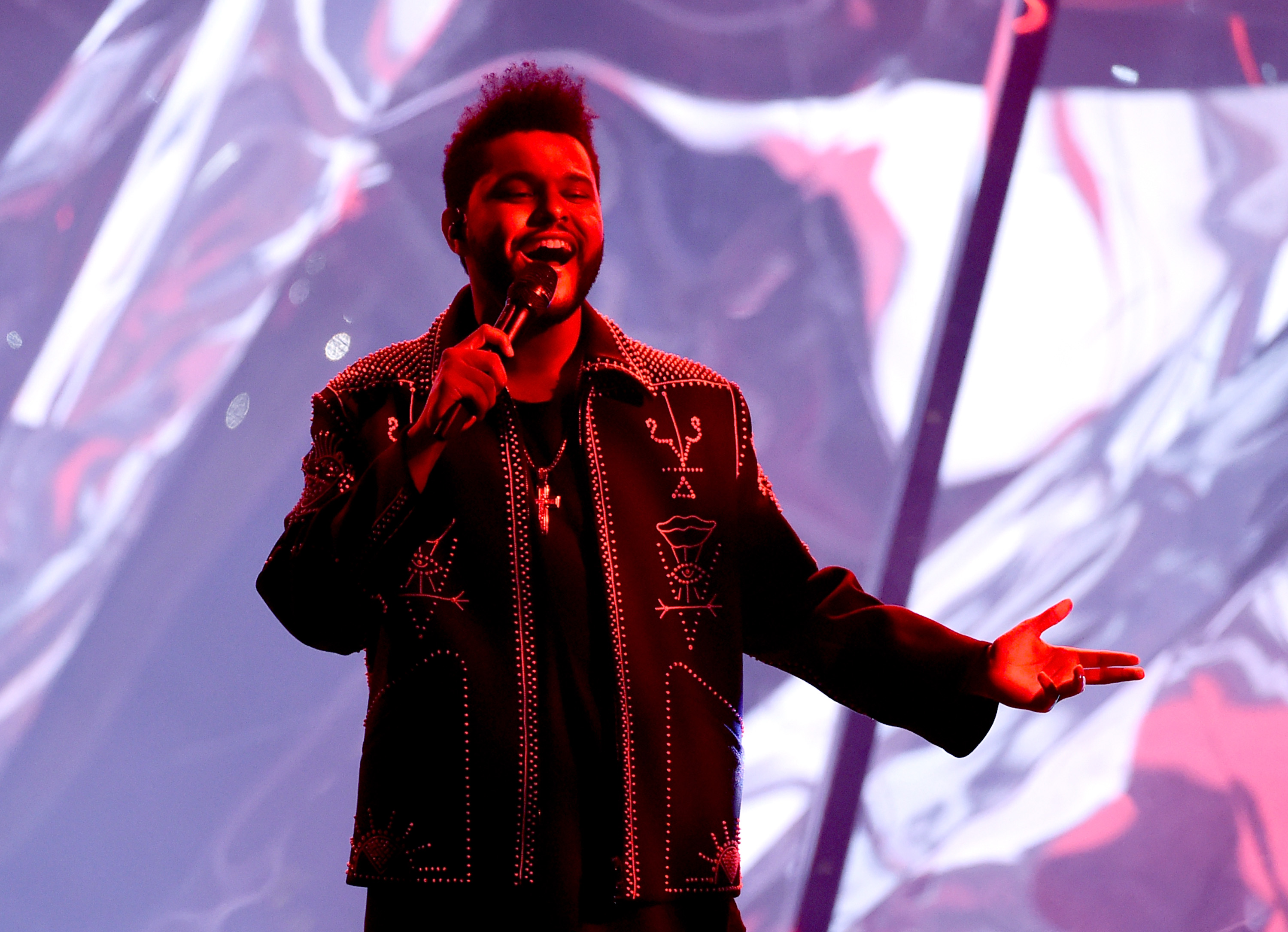 LOS ANGELES, CA - NOVEMBER 20: Recording artist The Weeknd performs onstage during the 2016 American Music Awards at Microsoft Theater on November 20, 2016 in Los Angeles, California. Kevin Winter/Getty Images/AFP