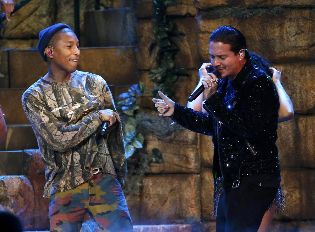 J Balvin (R) performs "Safari" with Pharrell Williams and Bia (not pictured) at the 17th Annual Latin Grammy Awards in Las Vegas, Nevada, U.S., November 17, 2016. REUTERS/Mario Anzuoni