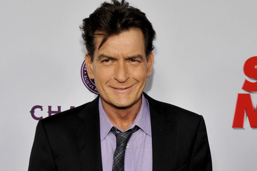 FILE - In this April 11, 2013 file photo, Charlie Sheen, a cast member in "Scary Movie V," poses at the Los Angeles premiere of the film at the Cinerama Dome in Los Angeles. Sheen was sued in Los Angeles Friday, Oct. 3, 2014, by a dental technician who claims the actor punched her in the chest and was abusive during an office visit in late September. (Photo by Chris Pizzello/Invision/AP, file)