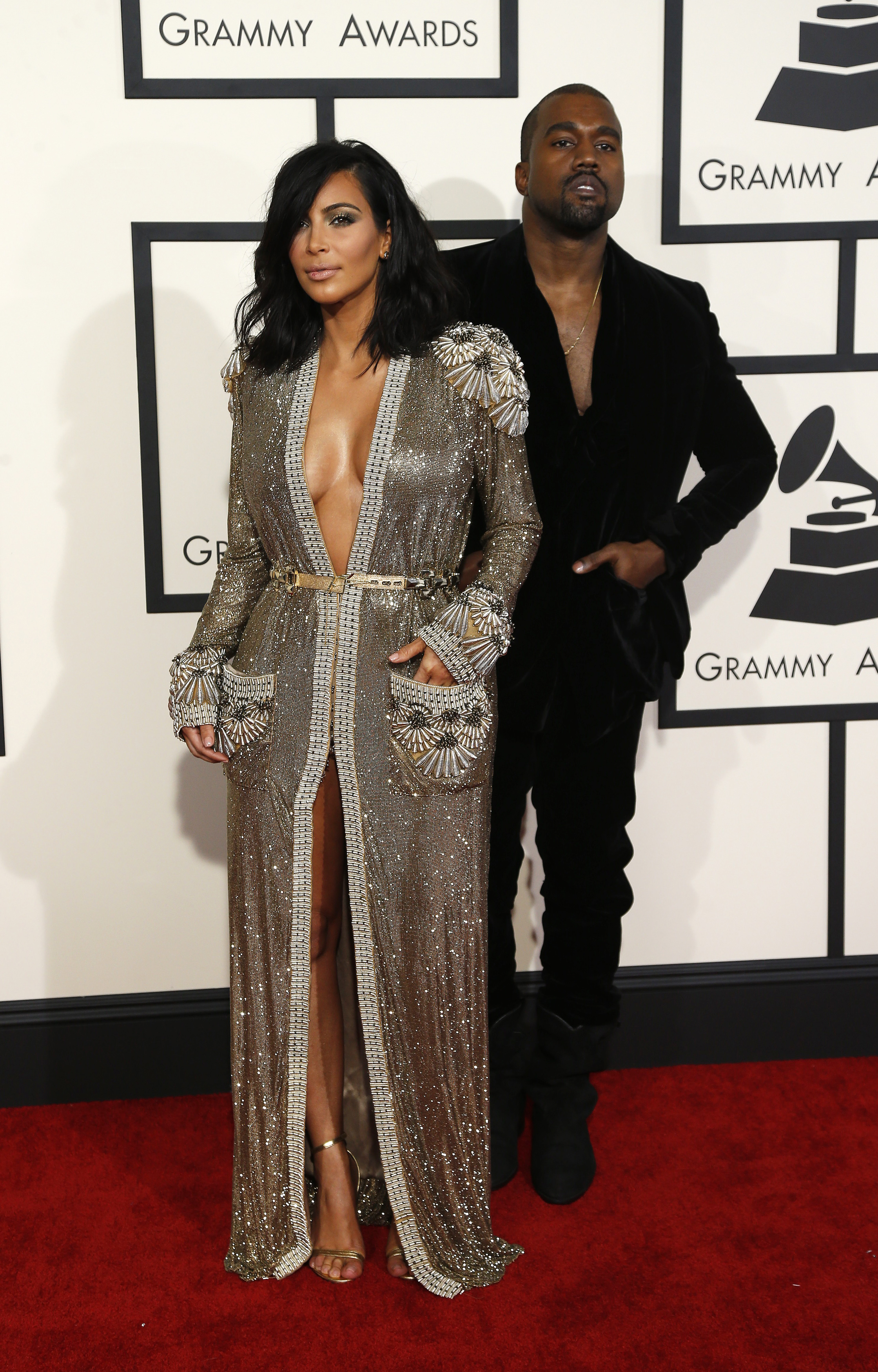Rapper Kanye West and Kim Kardashian arrive at the 57th annual Grammy Awards in Los Angeles, California February 8, 2015. REUTERS/Mario Anzuoni (UNITED STATES - TAGS: ENTERTAINMENT) (GRAMMYS-ARRIVALS) - RTR4OQT6