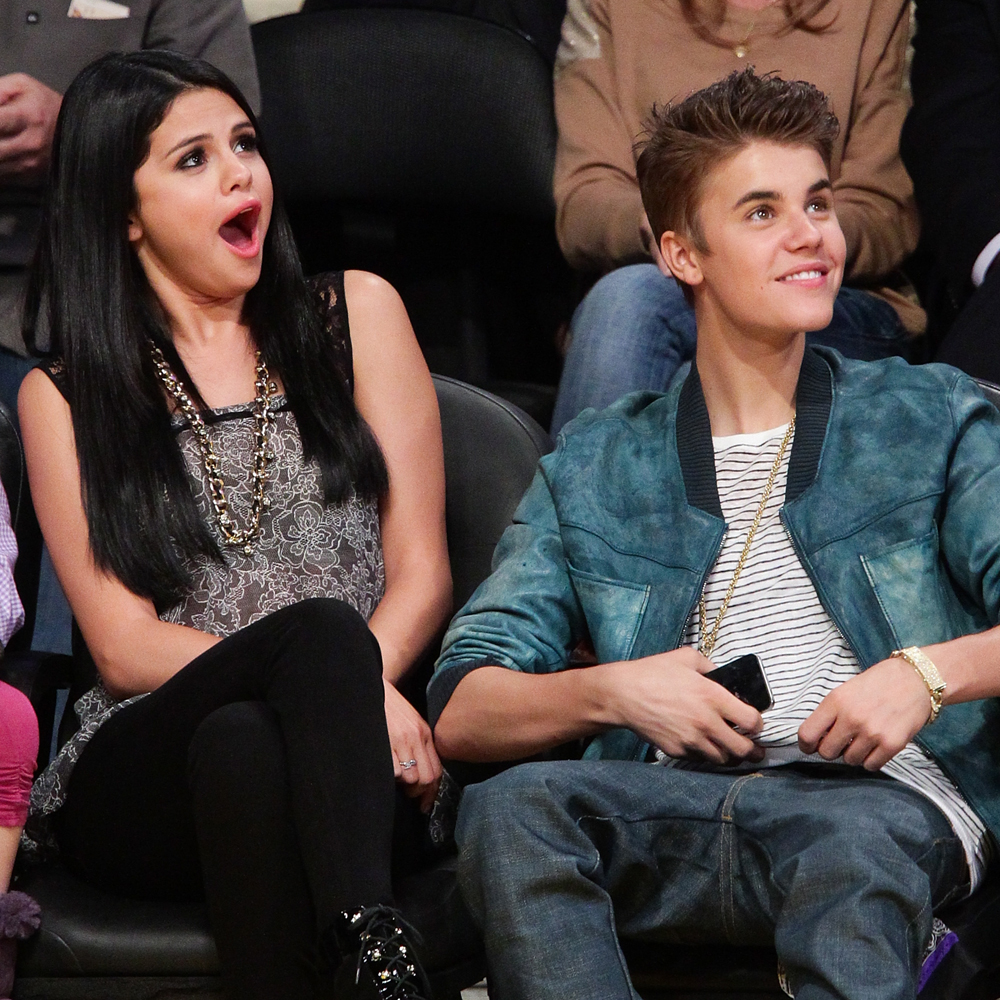 LOS ANGELES, CA - APRIL 17:  Selena Gomez (L) and Justin Bieber attend a basketball game between the San Antonio Spurs and the Los Angeles Lakers at Staples Center on April 17, 2012 in Los Angeles, California.  (Photo by Noel Vasquez/Getty Images)