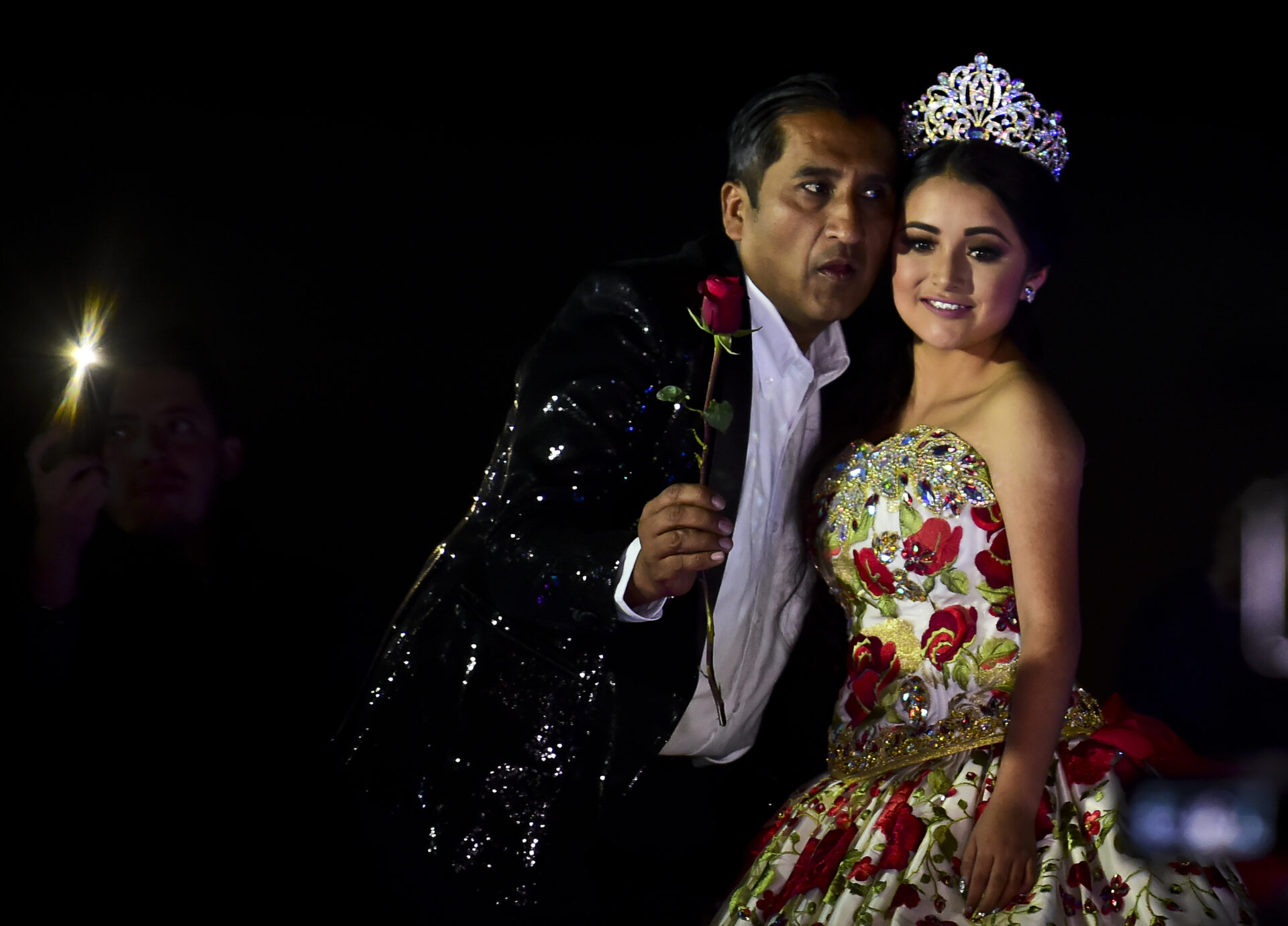 Rubi Ibarra poses during her 15th birthday celebrations in Villa Guadalupe, San Luis Potosi State, on December 26, 2016.  Rubi, a small-town Mexican teen, welcomed thousands of guests for her 15th birthday party  after her parents' video invitation to the milestone event went viral online.  / AFP PHOTO / RONALDO SCHEMIDT